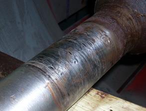 Scored shaft in a cooling system air handler fan